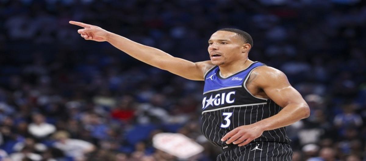 Bain scored 32 points as the Magic narrowly defeated the Jazz 128-127 in overtime.