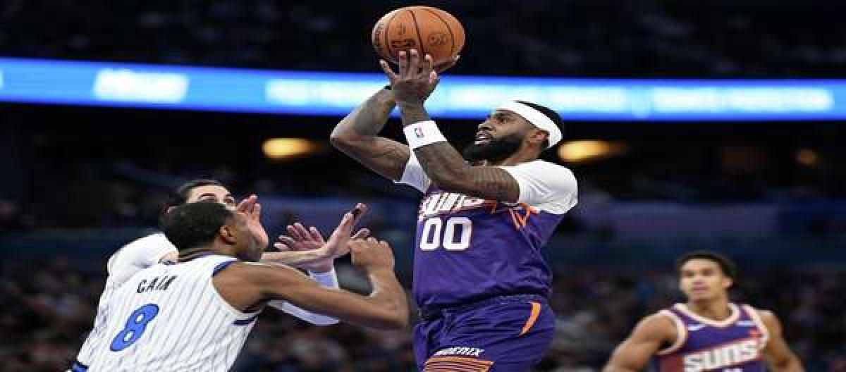 Booker's 34 points weren't enough to save the Magic from a narrow 115-111 victory over the Suns.