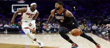 Powell scored 32 points, leading the Heat to a 127-115 victory over the 76ers.