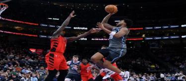 Holiday's 31 points shone as the Trail Blazers easily defeated the Jazz 136-119.