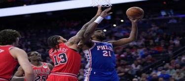 Embiid scored 35 points and George added 28, as the 76ers easily defeated the Bulls 157-137.
